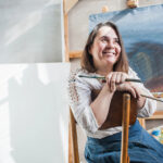 Woman-sitting-painting